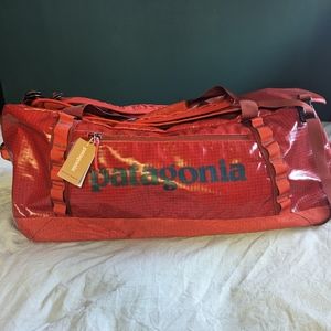 NWT Black Hole® Duffel Bag 70L Hot Ember